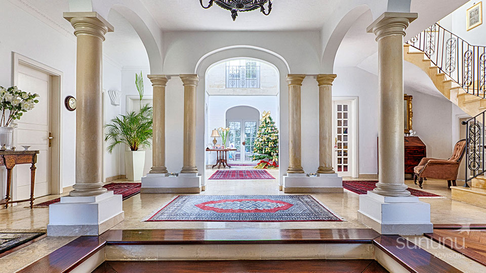 Imposing columns in entrance hall of villa in St. Julian's